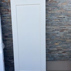 32 in. × 80 in. 1 Panel Lincoln Park Primed Solid Core Composite Interior Door Slab