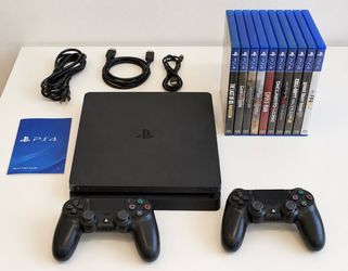 PlayStation 4 Slim 500GB + 2 Controllers + 8 Games – Excellent Condition