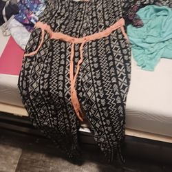 3 Women's Jumpsuits, A Romper, And a Sock Monkey onsie