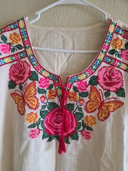 Blusa es como  XL