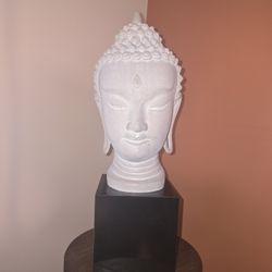 Vintage sculpture head with wooden stand.