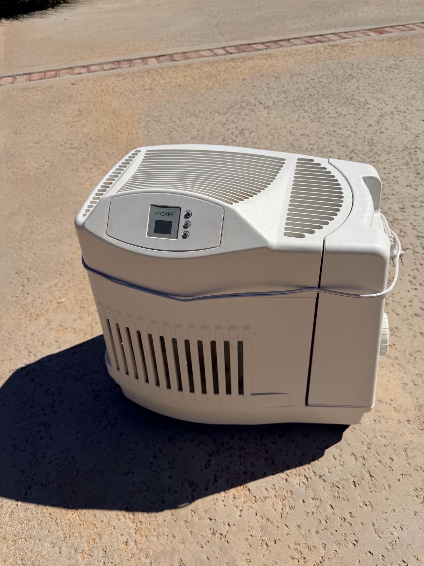 Whole house evaporative humidifier