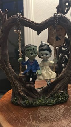 Frankenstein and Bride on A Swing