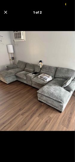 U shaped couch with storage and  chargers
