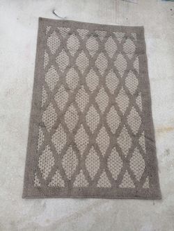 Rug size l46" x40" beige and brown as pictured