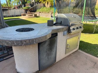 Island BBQ, Fridge and small glass fire pit.