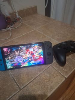 Nintendo Switch OLED/ Switch Pro controller/Mario Kart 8 (cartridge only) and SD card included