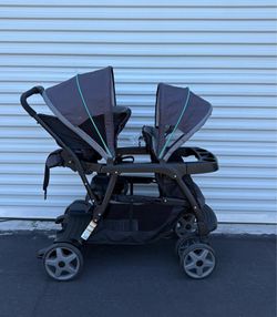 Graco Ready2Grow Click Connect LX Double Stroller in a gray and black color scheme.