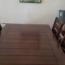 Solid wood dining set with chairs and  side bar Excellent condition like new no scratches.