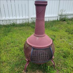 freestanding outdoor fireplace with a door that opens