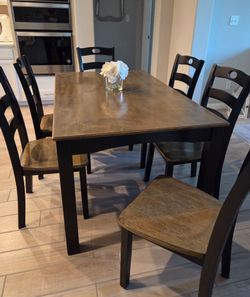 Wood Dining Set. Used, in good condition with normal wear! 

Dining Table 
60"L x 36"W x 30"H 

6 Chairs 

Decor Not Included 

$225