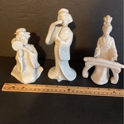 White porcelain Asian figurines $10 each. One is Fritz and Floyd