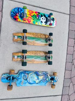 Four skateboards/longboards
