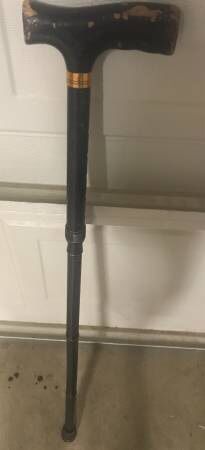 Black adjustable and folding walking cane