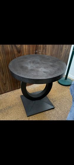 Black circular side table