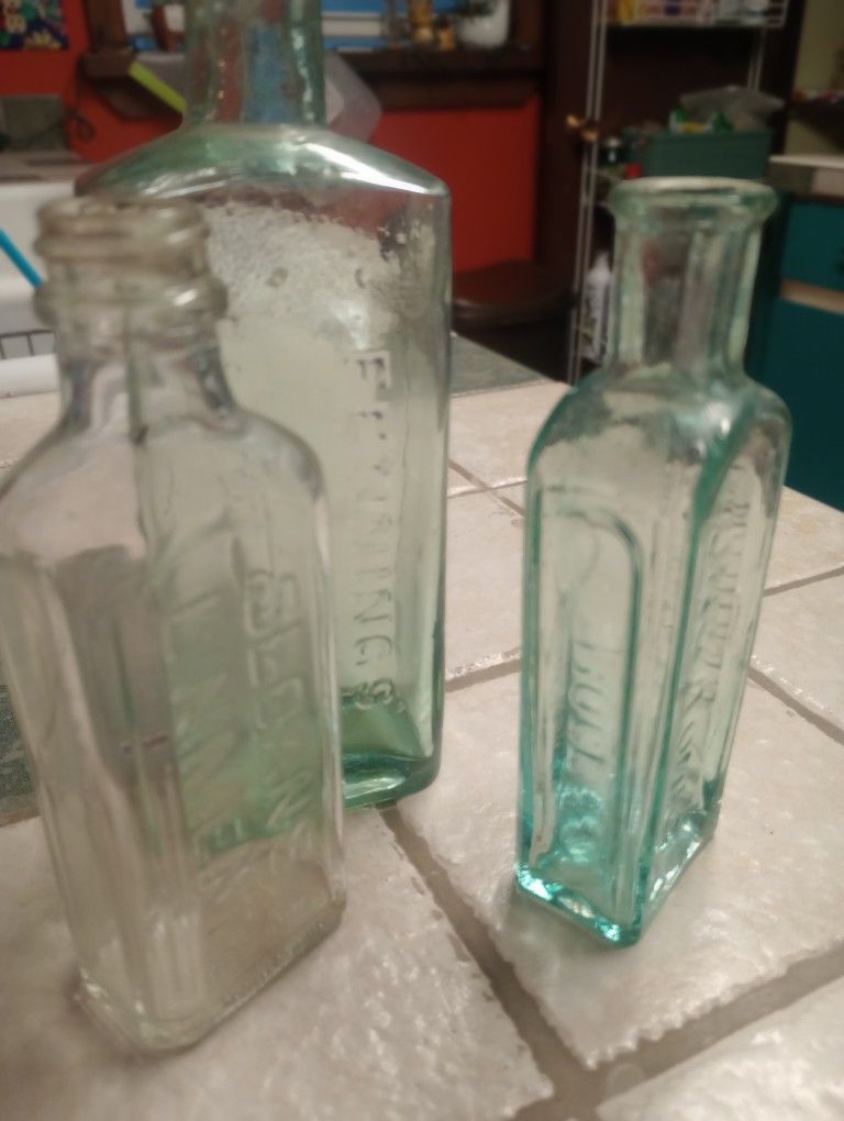 Three Antique Glass medicine bottles