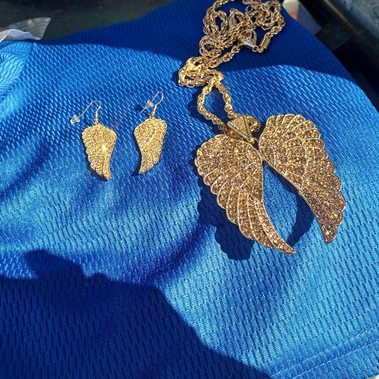 Bella Luce Champ crystal.\n Necklace and earrings.