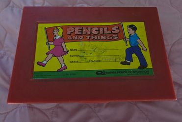 vintage Berol Turquoise lead pointer used for sharpening drafting pencil leads and a vintage Empire Pencil Corporation school box from the 1980s