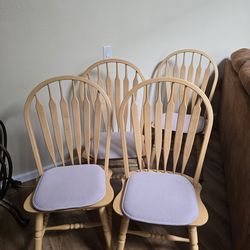 Four Windsor kitchen chairs with seat covers