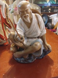 Beautiful porcelain Chinese fisherman
