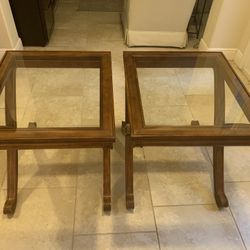 Two wooden glass top beveled end tables. 24 x 28” top and 25.5 inches tall both in excellent condition. $100.