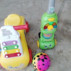 One Is Like A Vacuum Type Of Thing That Lights Up And Talks The Other One Is Like A Little Car That Has The Ringing Bells In The Front