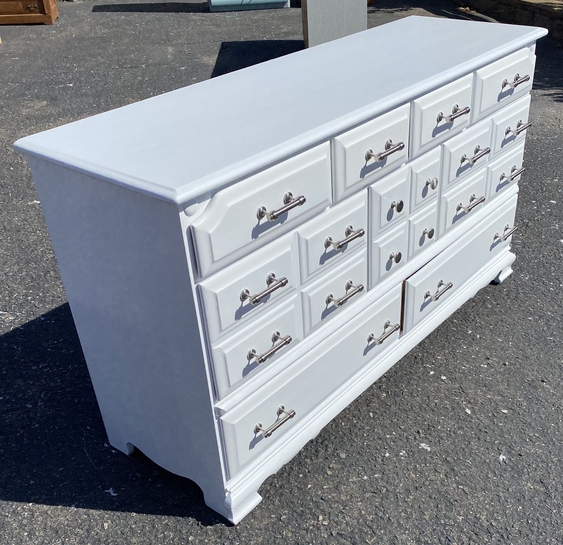 Dresser white 9 drawers All drawers slide great And is of dovetail construction #71750 Looks like it’s made out of birch The drawers have handles that