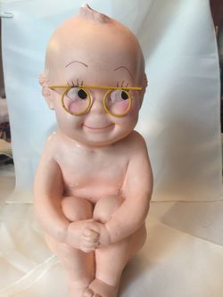 A.N. Brooks collectible baby bank with glasses.