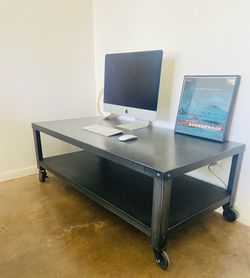 Metal coffee table/shelf. Wheels.