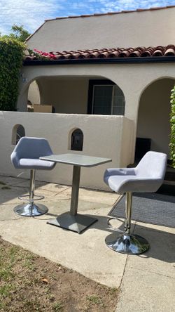 Three pieces set space saver two high chairs and table beautiful style and color adjustable chairs clean good condition size Table W24” D24” H29”