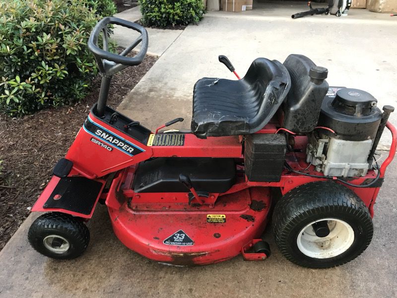 Snapper 12.5 hp with 33 inch cut rear engine riding lawnmower. Slow air leak on front tires.