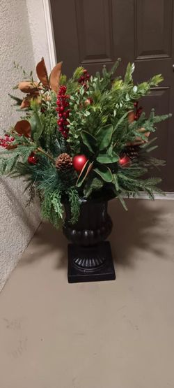 Festive Artificial Christmas greenery arrangement in a black decorative urn, accented w/ red berries