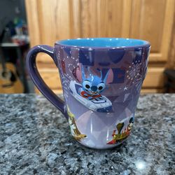 Ceramic Disney Parks Mug Cup by Joey Chou.  With Stitch on one side.  Capacity 11 ounces.  Brand new with tags.  