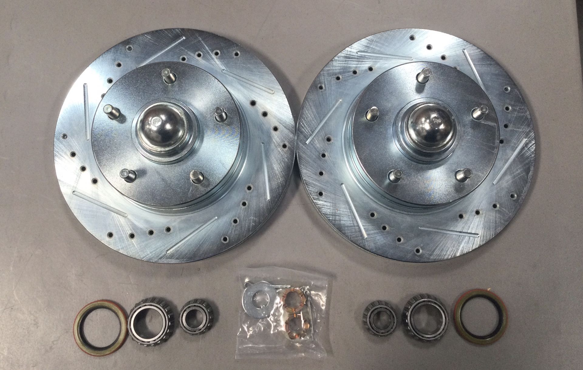 Brand New Replacement Drilled And Slotted Rotors Bearings Seals And Dust Caps For GM A F X body Cars For Factory Or Factory Replacement Spindle