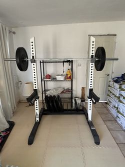 Squat Rack, Bar, And 190lbs Number Plates