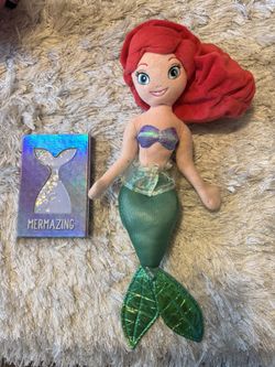The Little Mermaid doll and notebook