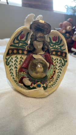 Angel With A  Globe With Bird In Side 