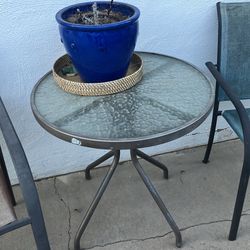 Table (chairs if you want them, sun damaged)