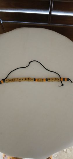 BRAND NEW "HALLOWEEN IS HERE "DECORATION.  WOODEN BEADS WITH ORANGE AND BLACK WOODEN AND PLASTIC BEADS