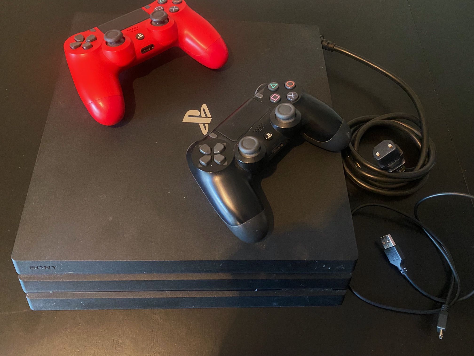 PS4 Pro 1TB w/ two controllers and two games