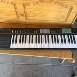 Yamaha PSR-12 portable electronic keyboard. 