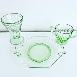 Dessert plates, handle dish, sugar holder and cup/vase in green depression glass