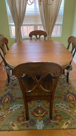 Pottery Barn dining table with extension leaf and four chairs