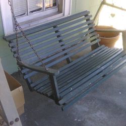 A Framed Wooden Porch Bench Swing 