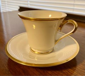 Ivory Porcelain Tea Cup and Saucer with Gold Trim