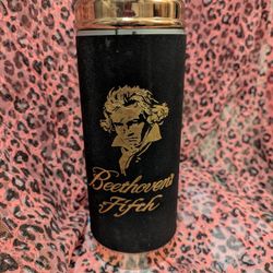 a vintage musical liquor decanter featuring Beethoven and his Fifth Symphony.