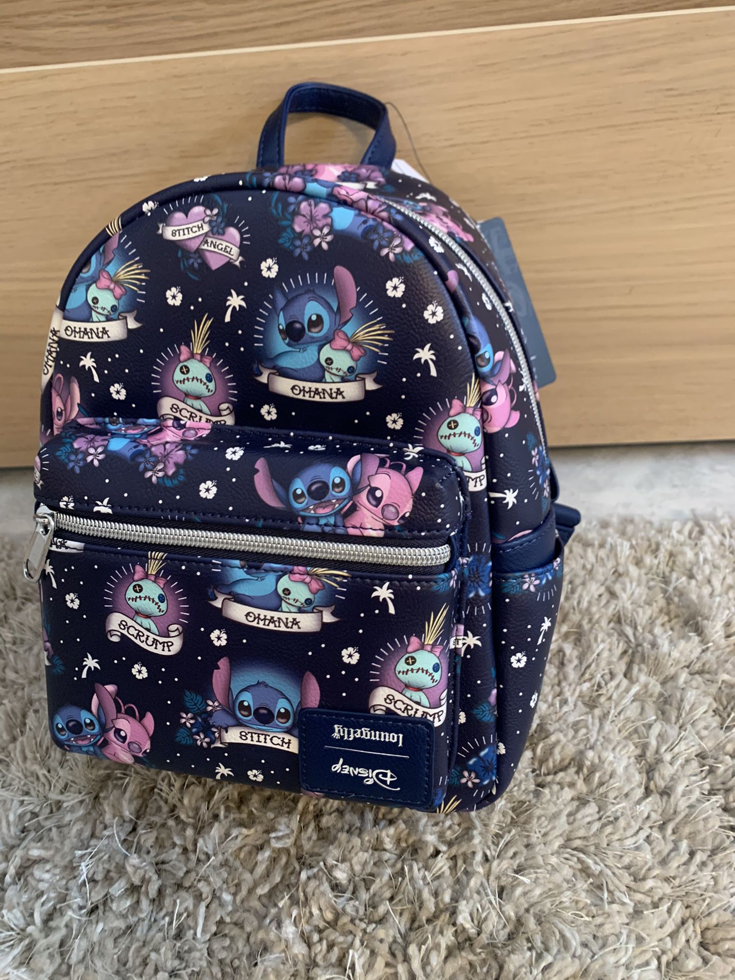 Disney Loungefly Lilo & Stitch Mini Backpack Flipped Disney Label Collector’s Item. 