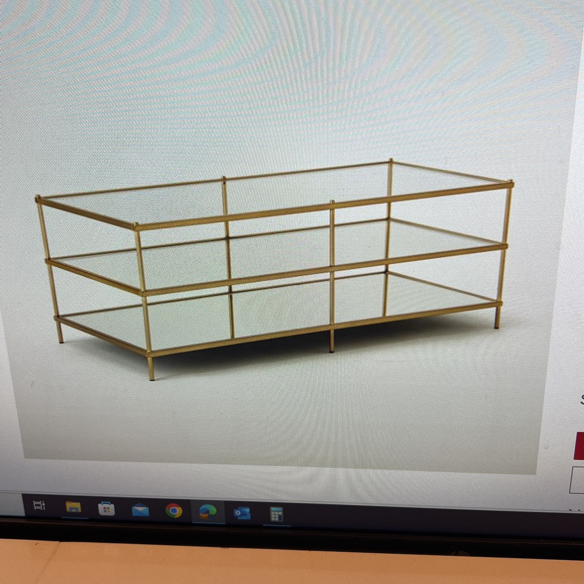 West Elm Minimalist Glass Top And Shelf Hover Over A Mirrored Base