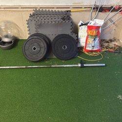 Olympic Lifting Bar, Two 15lbs Weights And Two 45lbs Weights 
