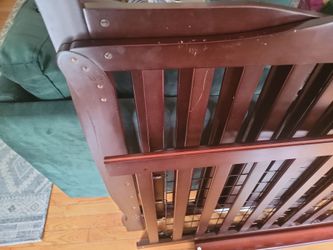 Baby crib still new a lil scratch due to moving it out